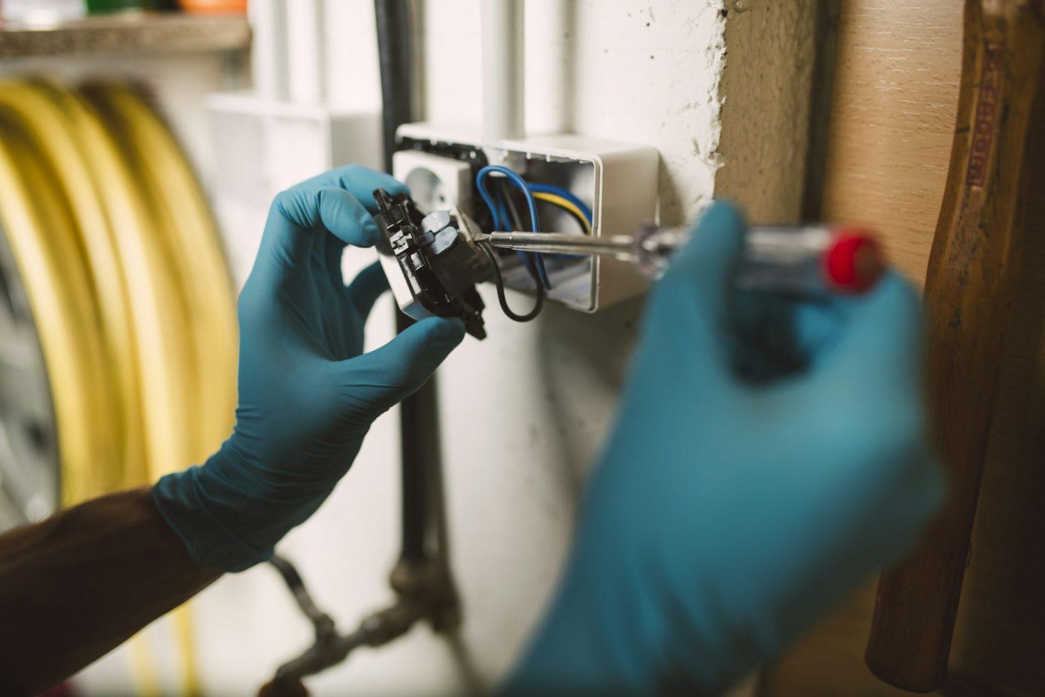 Detail of a man working on an electrical installation